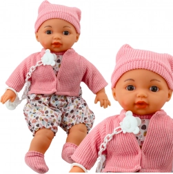 Laleczka Niemowlę z czapeczką i smoczkiem na łańcuszku Różowa 40 cm