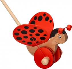 Drewniany pchacz biedronka na kiju