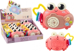 Różowy interaktywny krab z projektorem i grzechotką na baterie