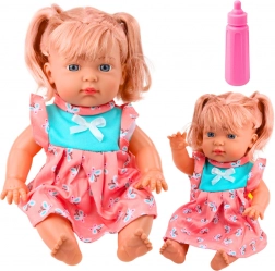 Lalka niemowlę w kolorowej sukience z butelką i dźwiękami