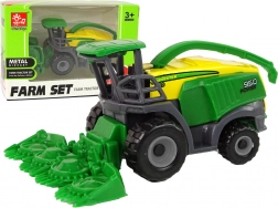 Zielona mała zabawkowa maszyna żniwna – kombajn