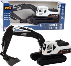 Duża koparka gąsienicowa z metalową łyżką i ruchomymi przegubami