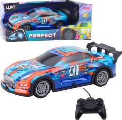 RC samochód wyścigowy ze świecącą karoserią, pomarańczowo‑turkusowy