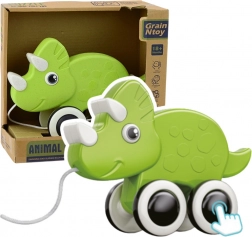 Zielony dinozaur do ciągnięcia z piszczałką