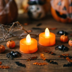 Halloweenowe pomarańczowe świeczki LED typu tealight, 2 szt.