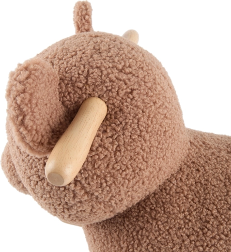 Miękka powierzchnia bouclé, która zachęca do przytulania