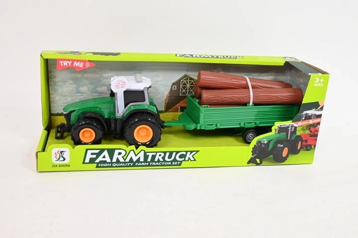 Traktor z przyczepą i kłodami