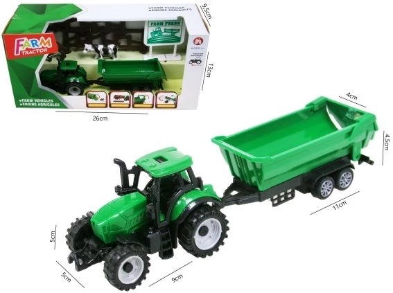 Zielony traktor z przyczepą i akcesoriami