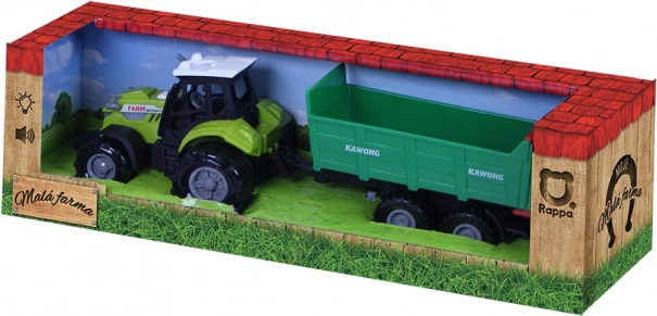 Traktor z dźwiękami i światłem z zieloną przyczepą