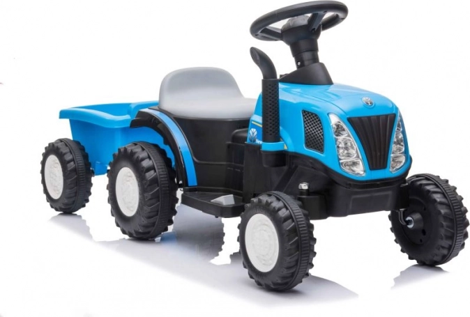 Dziecięcy niebieski traktor na akumulator z przyczepą