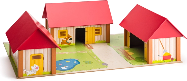 Drewniana farma z trzema budynkami i matą do zabawy