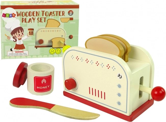 Drewniany toster z kuchennymi akcesoriami dla dzieci