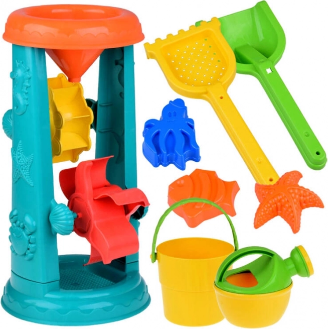 Duży zestaw zabawek do piasku z wiaderkiem, grabkami i kołem wodnym