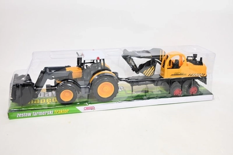 Traktor z maszyną budowlaną
