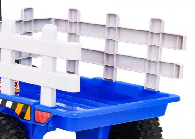 Dziecięcy traktor z przyczepą niebieski