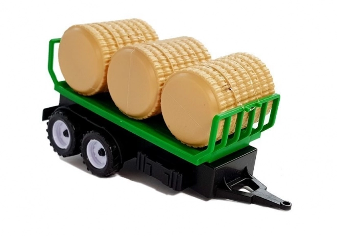 Traktor z przyczepą na bele siana Cysterna