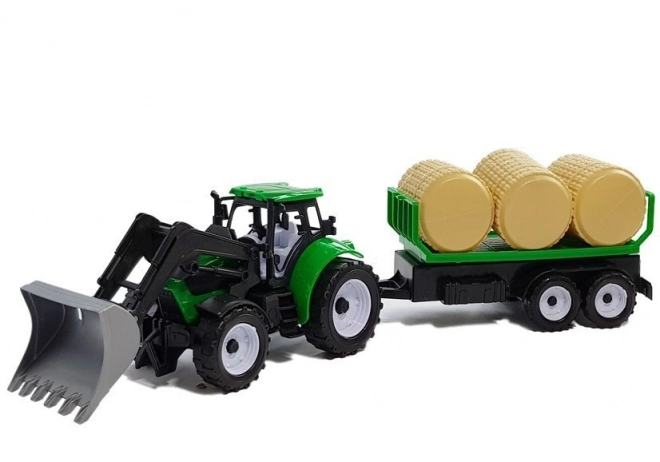 Traktor z przyczepą na bele siana Cysterna