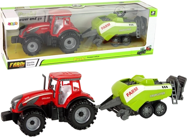 Czerwony traktor z zielonym siewnikiem z napędem ciernym