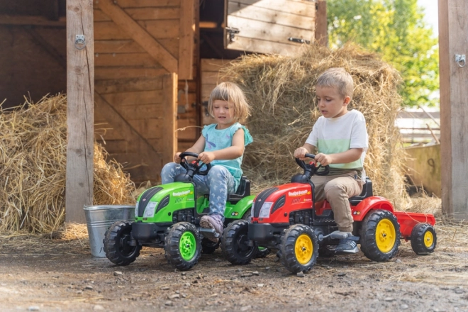 Pedałowy traktor z przyczepą czerwony