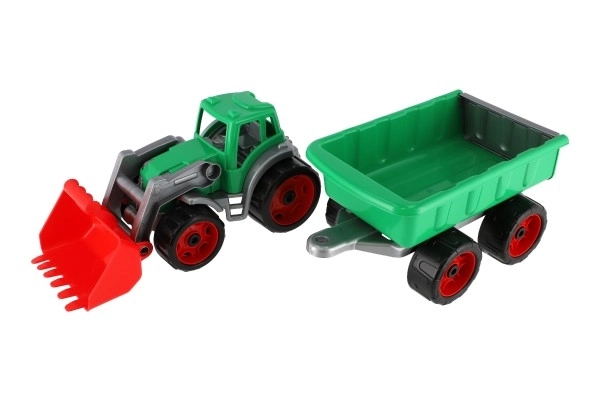 Traktor/ładowarka/koparka z przyczepą z plastikową łyżką na wolnym biegu 2 kolory w siatce 16x61x16cm