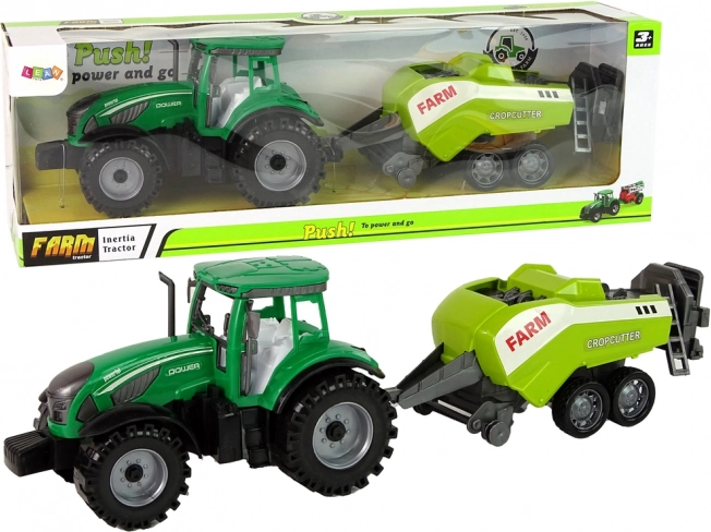 Zielony traktor z napędem frykcyjnym i odłączaną kosiarką