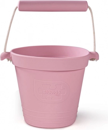 Silikonowe wiaderko plażowe jasnoróżowe BIGJIGS TOYS