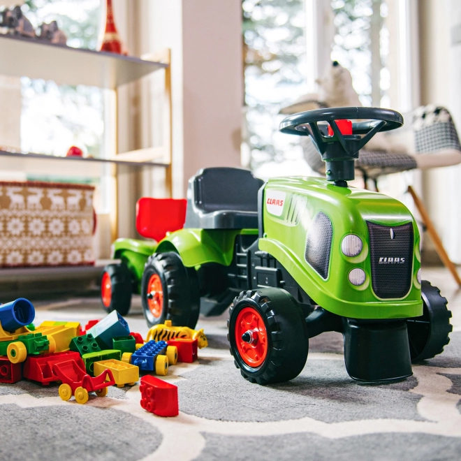 Jeździk traktor Claas zielony z kierownicą i przyczepą