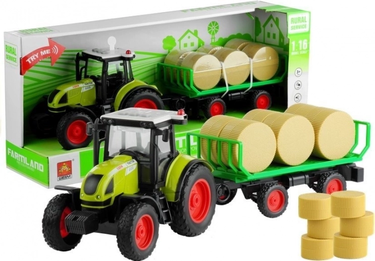 Zielony traktor z przyczepą i belami siana ze światłami i dźwiękami 37,5 cm