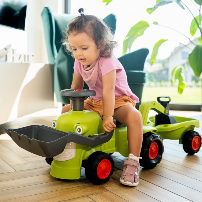Jeżdżący traktor Claas z przyczepą, ładowaczem i łyżką