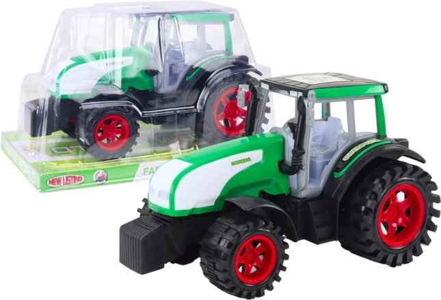 Duży zielony rolniczy traktor na napęd cierny (inercyjny)