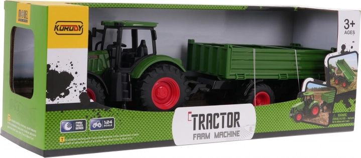 Zielony traktor z przyczepą