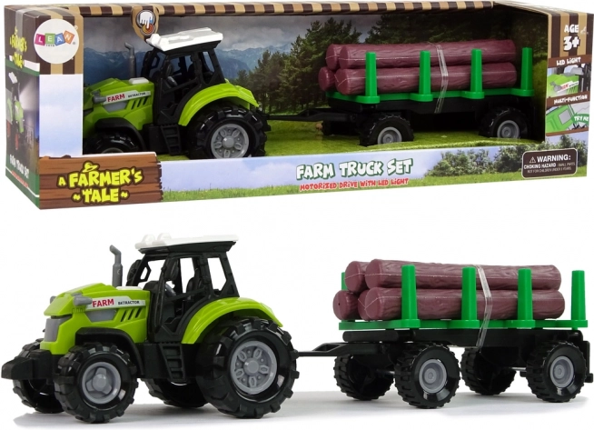 Zielony traktor z przyczepą na kłody ze światłem i dźwiękami