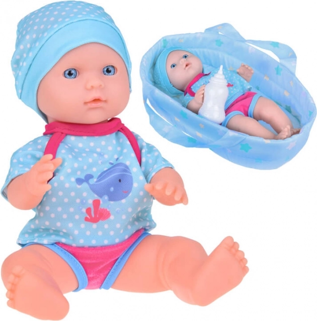 Lalka w nosidełku YaYa Baby pije i siusia