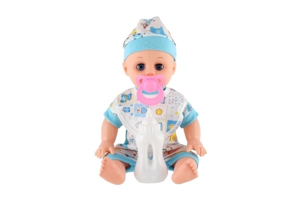 Lalka niemowlę plastykowe 32cm solidne ciało pijąca, sikająca na baterie z dźwiękiem z akcesoriami w worku