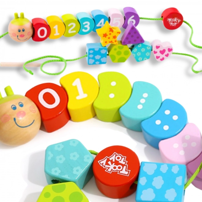 Drewniana sznurowa gąsienica TOOKY TOY