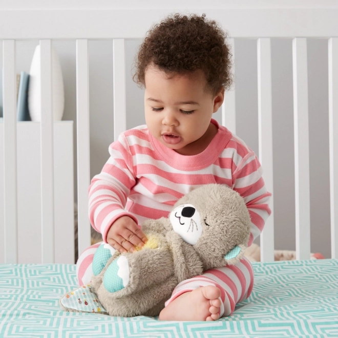 Fisher-Price Kojąca wydra z melodiami FXC66