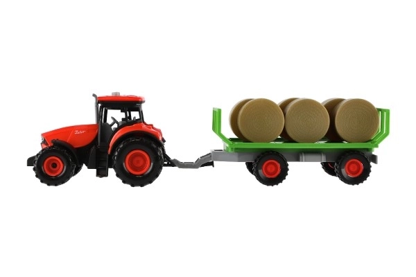 Traktor Zetor z przyczepą i belami plastikowymi 36cm na mechanizm inercyjny na bat. z światłem i dźwiękiem w opak. 39x13