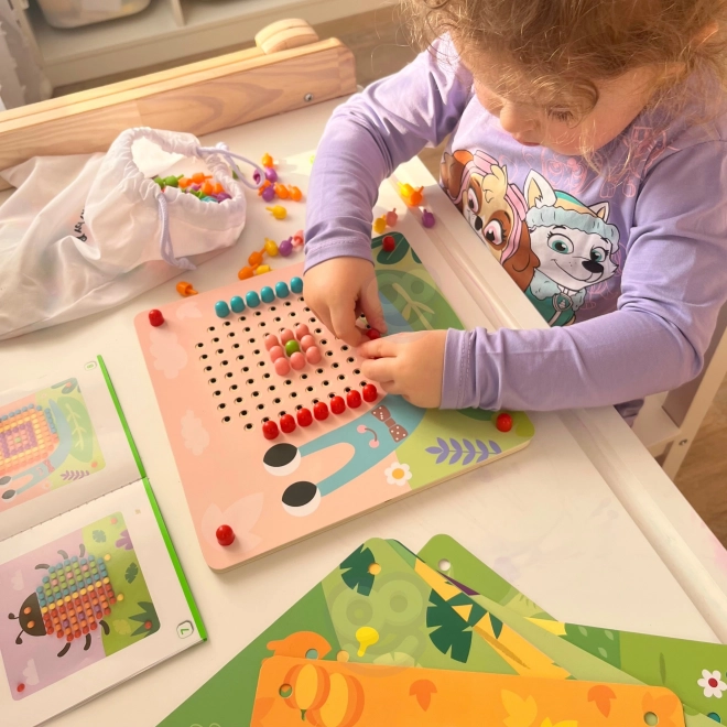 Drewniana układanka z kołeczkami od Tooky Toy