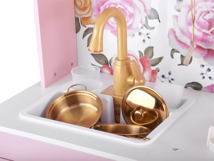 Funkcyjny zlew ze złotą baterią