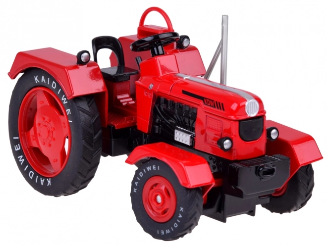 Czerwony metalowy traktor z gumowymi kółkami 1:18