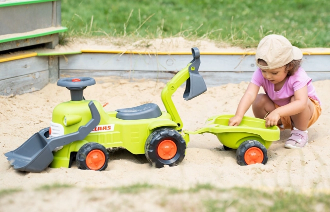 Jeżdżący traktor Claas z przyczepą, ładowaczem i łyżką