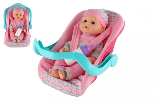 Lalka niemowlę 30cm z plastiku w nosidełku/fotelik samochodowy z butelką w blisterze
