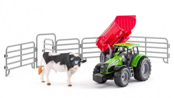 Traktor z przyczepą i bykiem z ogrodem