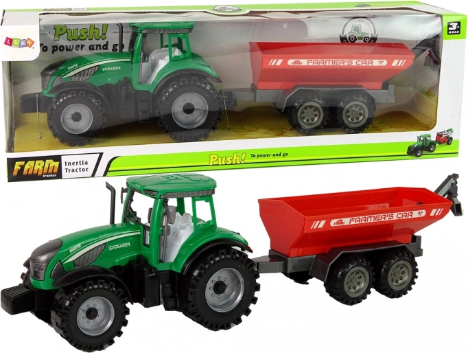 zielony traktor z czerwonym przyczepą z napędem ciernym