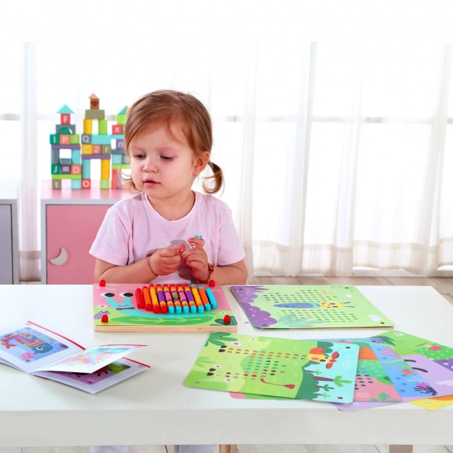 Drewniana układanka z kołeczkami od Tooky Toy