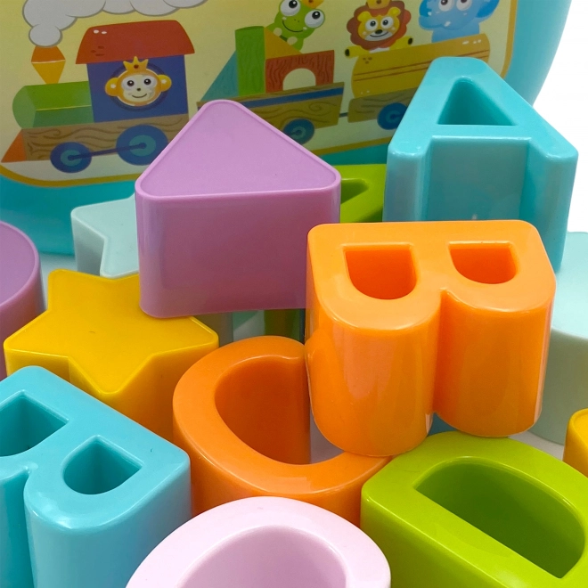 Sorter dziecięcy Woopie i walizka z nauką alfabetu i kształtów