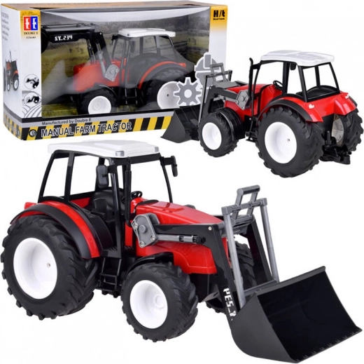 Duży czerwony traktor z ruchomym ramieniem i dużymi kołami