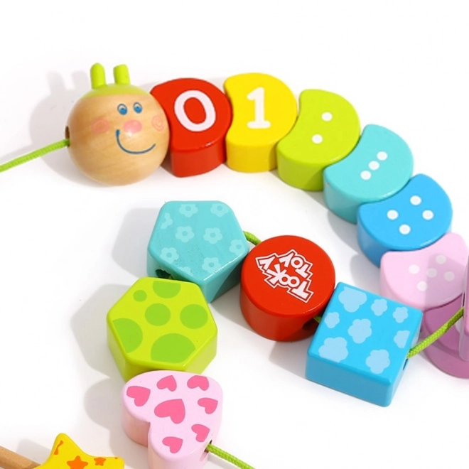 Drewniana sznurowa gąsienica TOOKY TOY