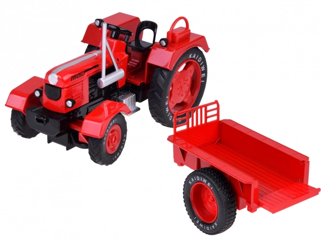 Czerwony metalowy traktor z gumowymi kółkami 1:18