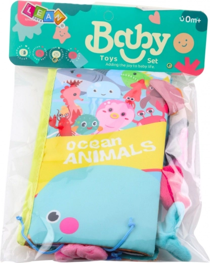 Szeleszczące strony i piszczałka dla sensorycznej zabawy